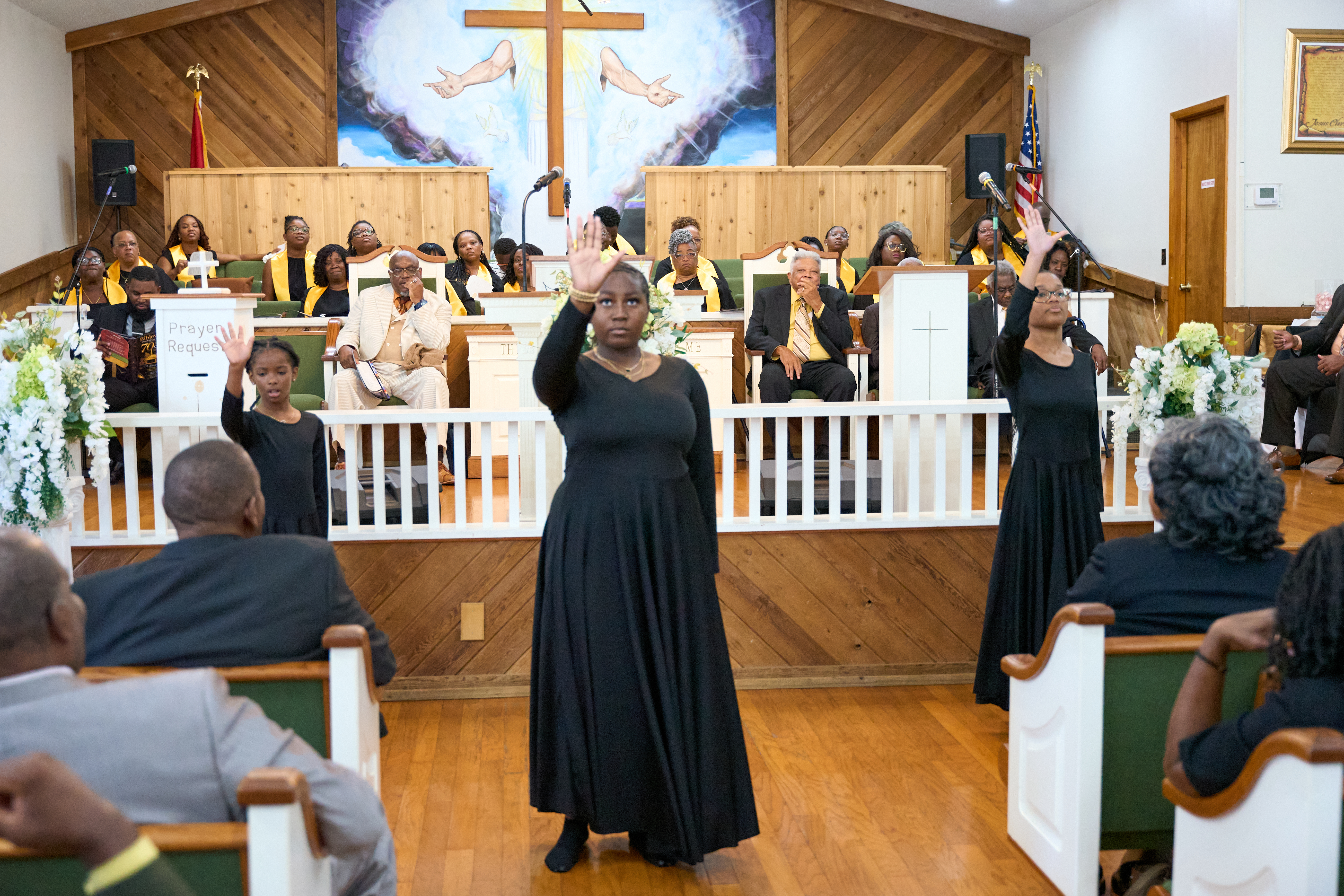 Worshipers with hands raised in praise